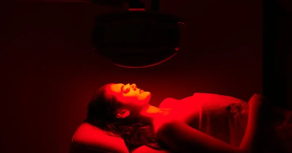 Patient receiving professional red light therapy treatment in a clinical setting